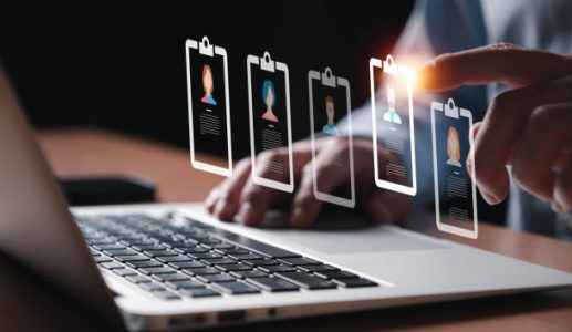 Entrepreneur using electronic devices for store customer data to gain customer insight in order to create marketing campaign that can help to increase sale and identify potential customer.